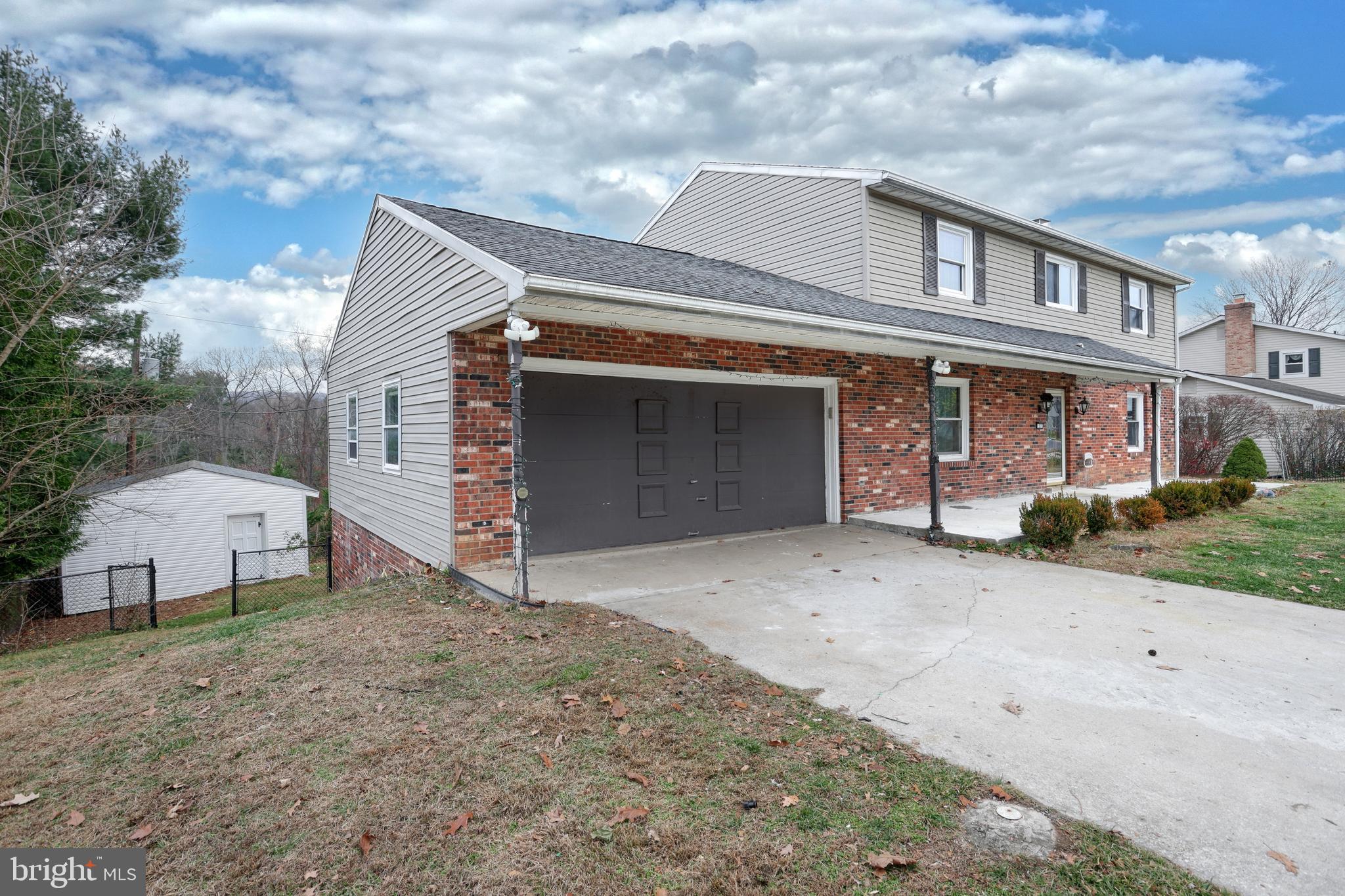1373 Quail Hollow Road Harrisburg, PA 17112 - Photo 3 of 68 a front view of a house with a yard and garage