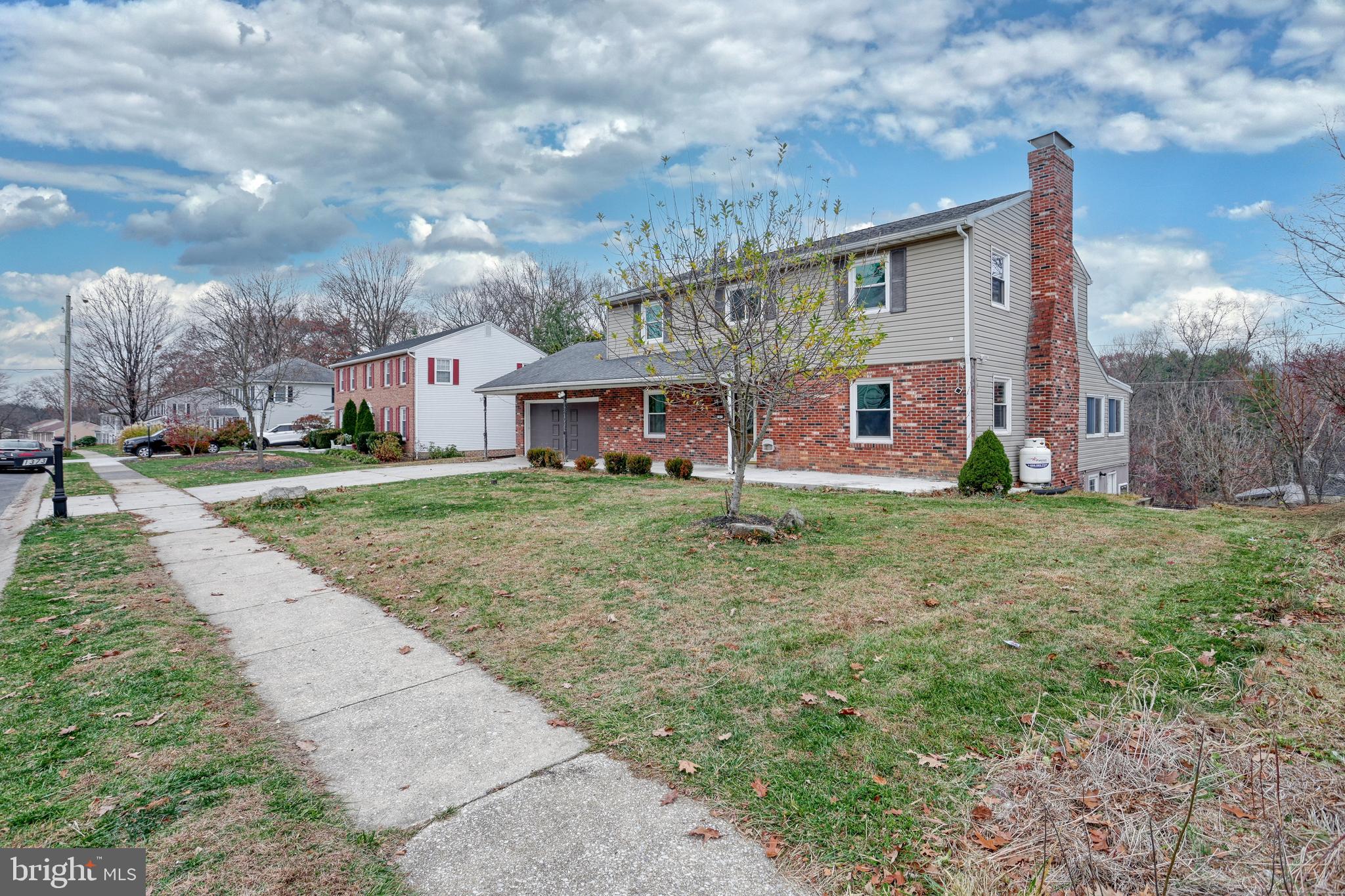 1373 Quail Hollow Road Harrisburg, PA 17112 - Photo 4 of 68 a view of large house with a big yard and large trees