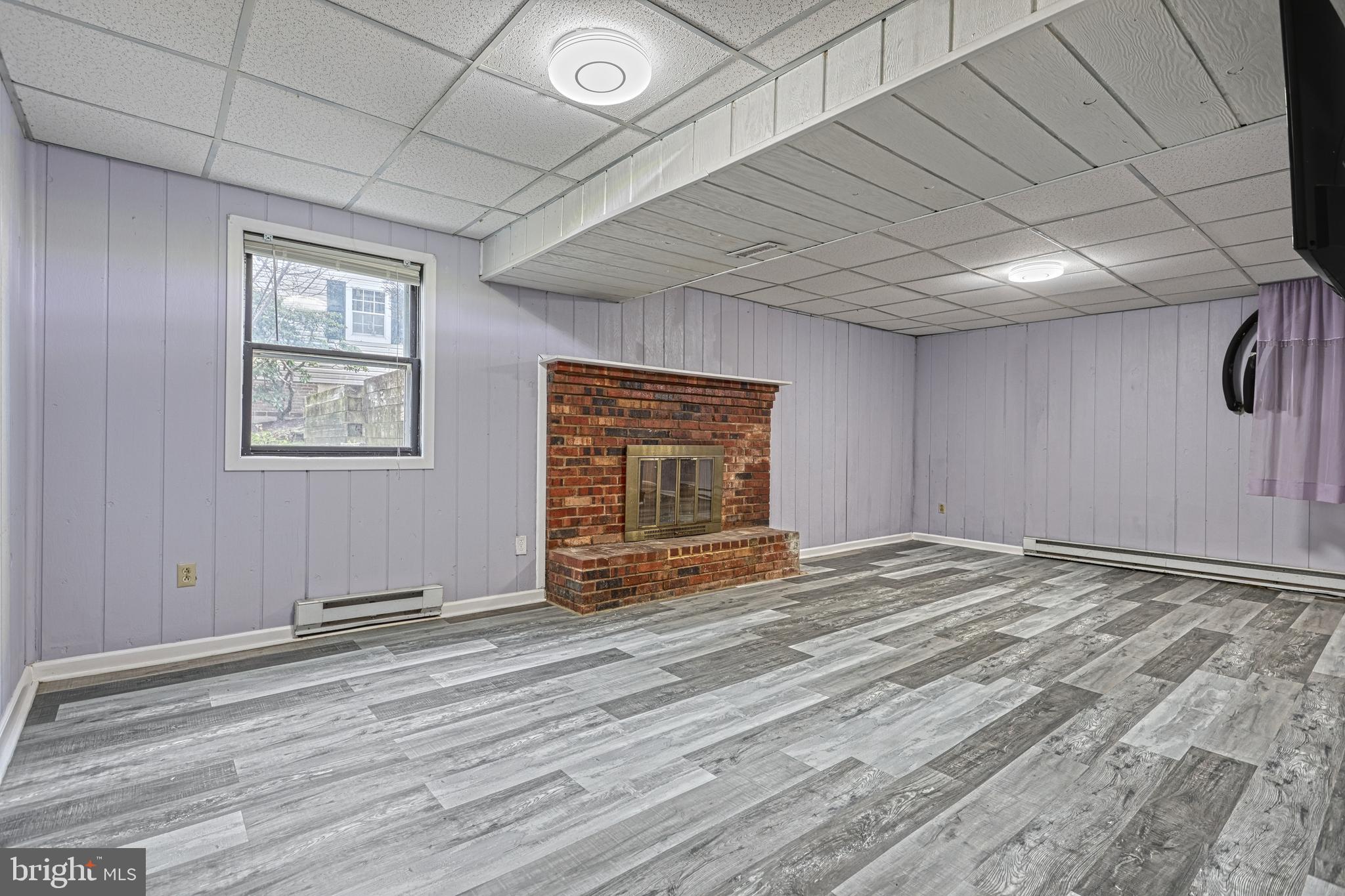 1373 Quail Hollow Road Harrisburg, PA 17112 - Photo 43 of 68 a view of an empty room with wooden floor and a window