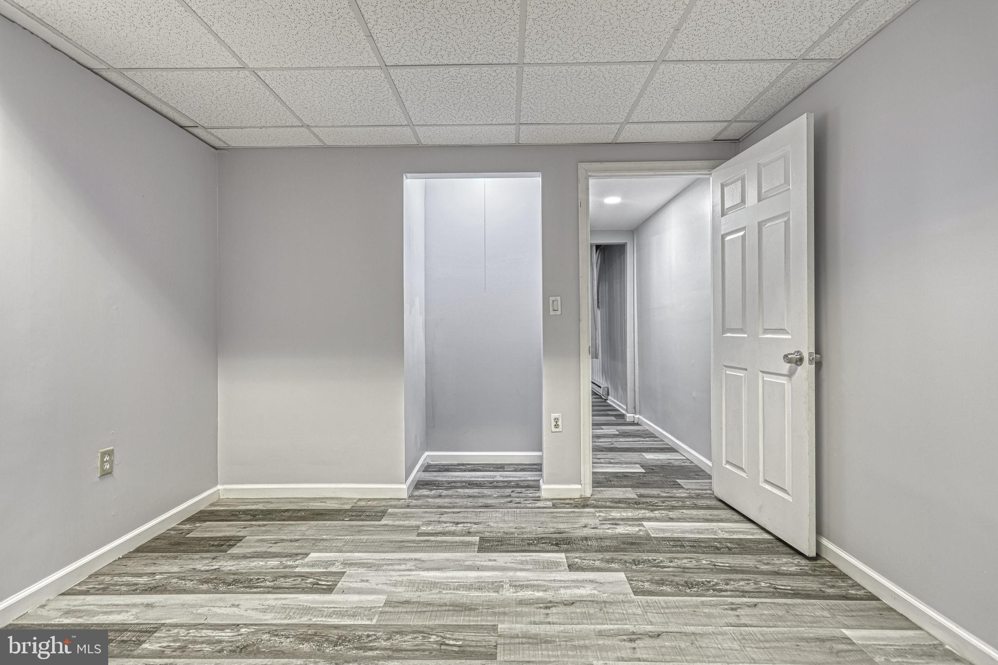 1373 Quail Hollow Road Harrisburg, PA 17112 - Photo 46 of 68 a view of a hallway with wooden floor and staircase