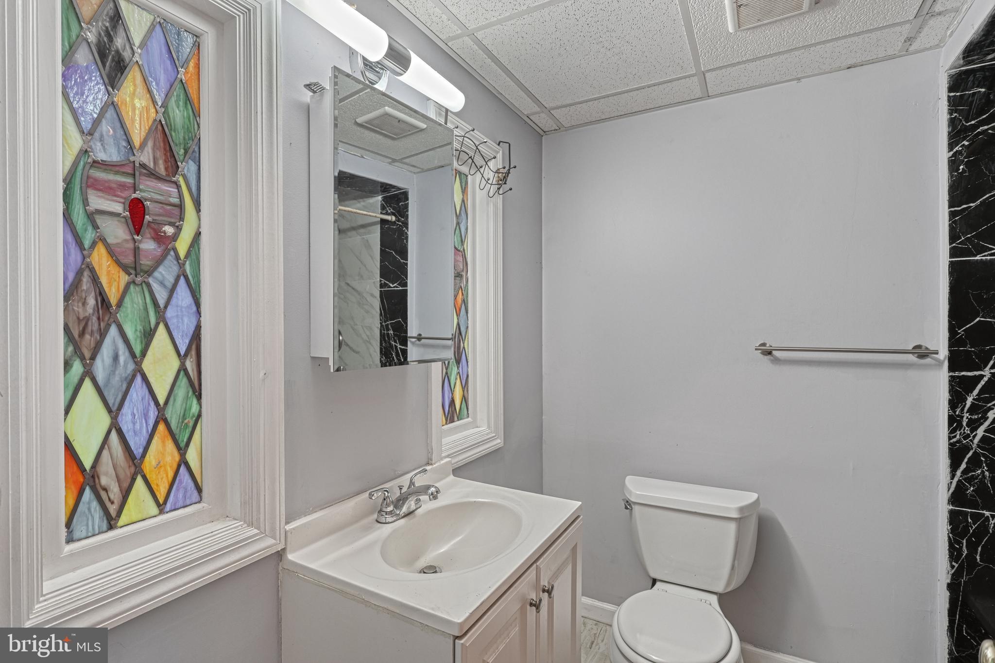 1373 Quail Hollow Road Harrisburg, PA 17112 - Photo 52 of 68 a bathroom with a toilet sink and mirror
