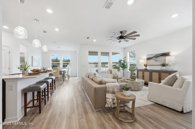 a bedroom with a bed and a potted plant