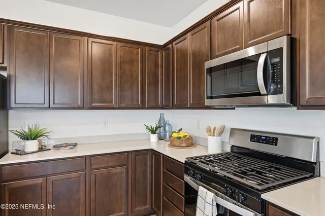 a view of a room with gym equipment and a large window