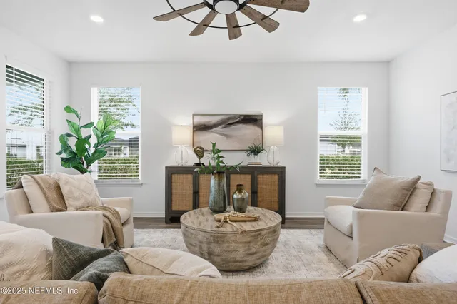 a living room with furniture and a large window