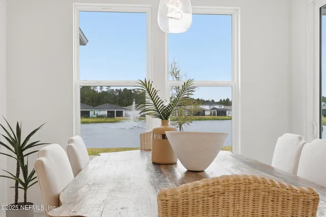 a bathroom with a sink a toilet and shower curtain