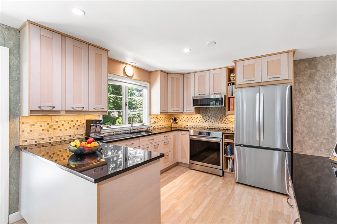 71 Primrose Hill Road Barrington, RI 02806 - Photo 10 of 49 Updated Kitchen with stainless steel appliances and granite countertops