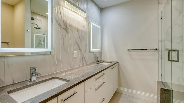 a view of roof deck with couches and potted plant