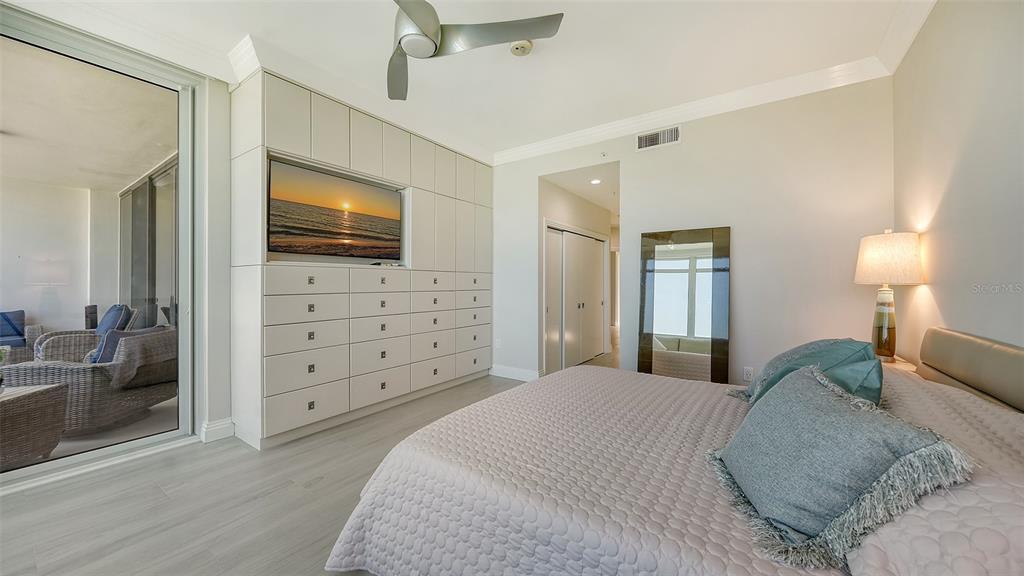 535 Sanctuary Drive, Unit C807 Longboat Key, FL 34228 - Photo 28 of 56 a bedroom with a bed and a flat screen tv
