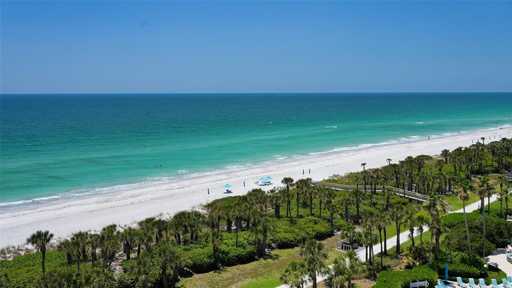 535 Sanctuary Drive, Unit C807 Longboat Key, FL 34228 - Photo 32 of 56 a view of a lake with beach and outdoor space