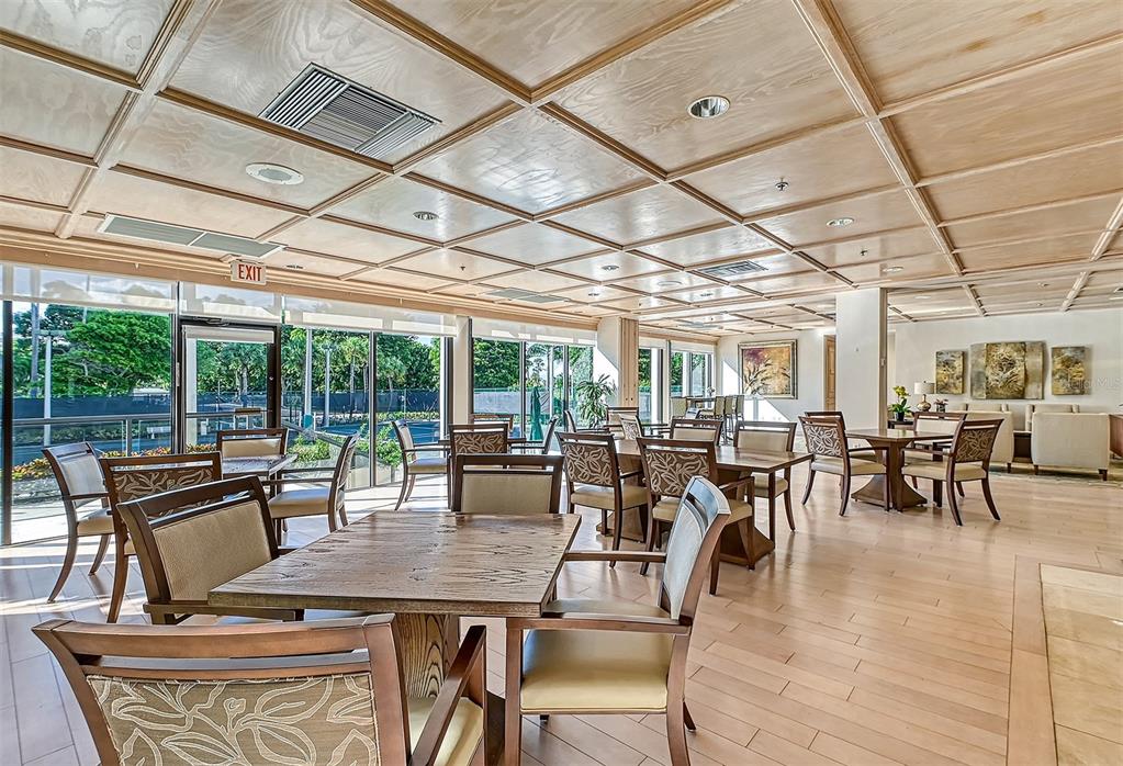 535 Sanctuary Drive, Unit C807 Longboat Key, FL 34228 - Photo 46 of 56 a view of a dining room with furniture window and outside view