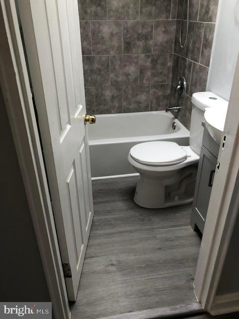 2802 Windsor Avenue Baltimore, MD 21216 - Photo 15 of 37 a bathroom with a toilet and a shower