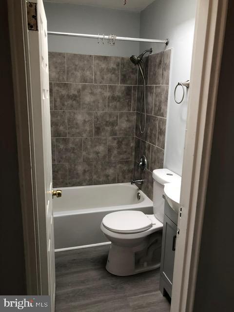 2802 Windsor Avenue Baltimore, MD 21216 - Photo 16 of 37 a bathroom with a toilet and a shower