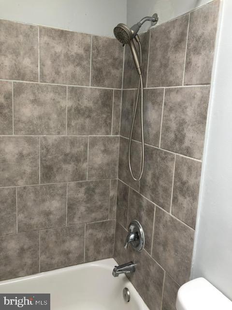 2802 Windsor Avenue Baltimore, MD 21216 - Photo 17 of 37 a bathroom with a toilet and a shower