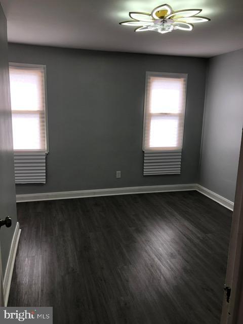 2802 Windsor Avenue Baltimore, MD 21216 - Photo 21 of 37 wooden floor in an empty room with a window