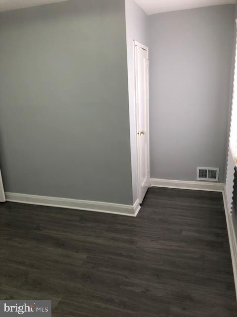 2802 Windsor Avenue Baltimore, MD 21216 - Photo 23 of 37 a view of an empty room with wooden floor