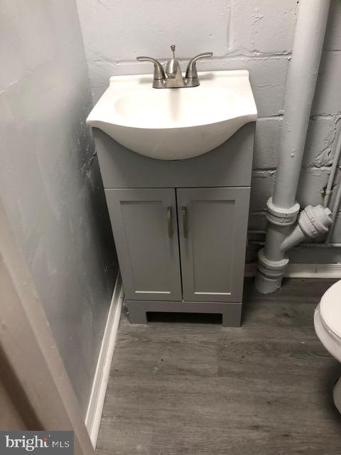 2802 Windsor Avenue Baltimore, MD 21216 - Photo 30 of 37 a bathroom with a sink and toilet