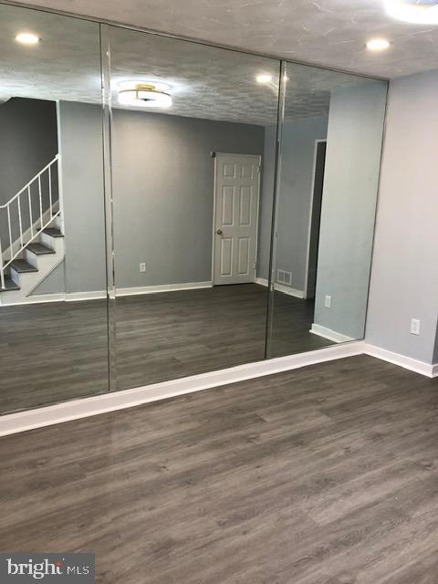 2802 Windsor Avenue Baltimore, MD 21216 - Photo 3 of 37 a view of an empty room with wooden floor