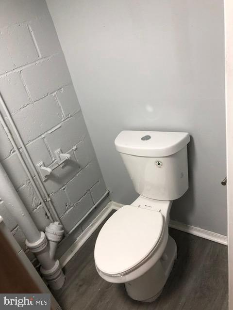 2802 Windsor Avenue Baltimore, MD 21216 - Photo 32 of 37 a white toilet sitting next to a bathroom sink