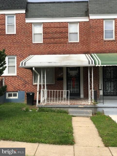 2802 Windsor Avenue Baltimore, MD 21216 - Photo 36 of 37 a view of a house with a yard and sitting area
