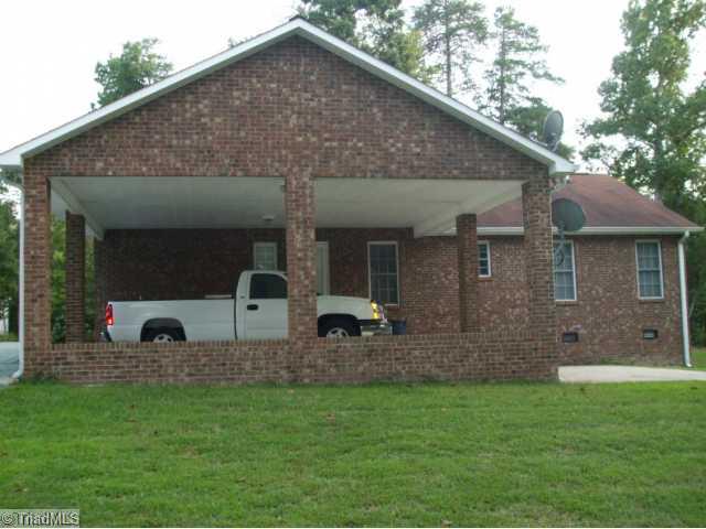 2835 Timber Ridge Lake Road Liberty, NC 27298 - Photo 7 of 7 Other. Attached double carport & patio