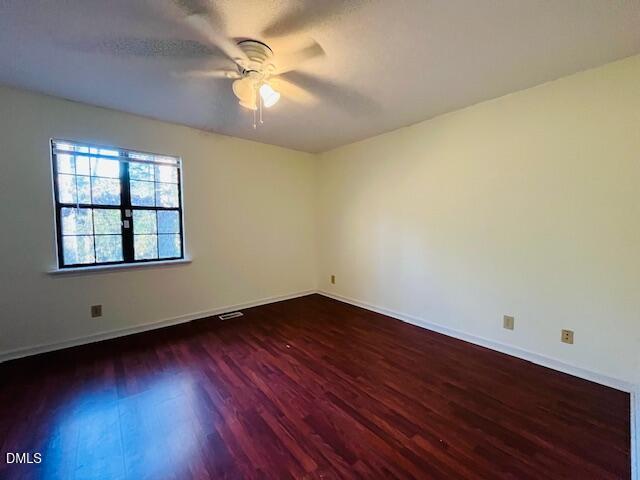 3315 Swansea Street Durham, NC 27707 - Photo 12 of 19 an empty room with wooden floor and windows