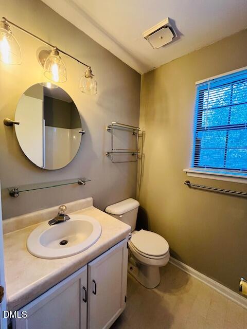 3315 Swansea Street Durham, NC 27707 - Photo 14 of 19 a bathroom with a sink toilet and mirror