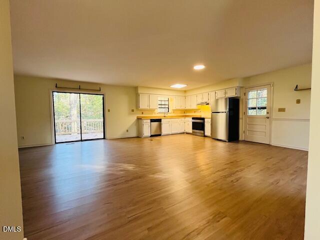 3315 Swansea Street Durham, NC 27707 - Photo 8 of 19 a view of a kitchen with a sink and a refrigerator