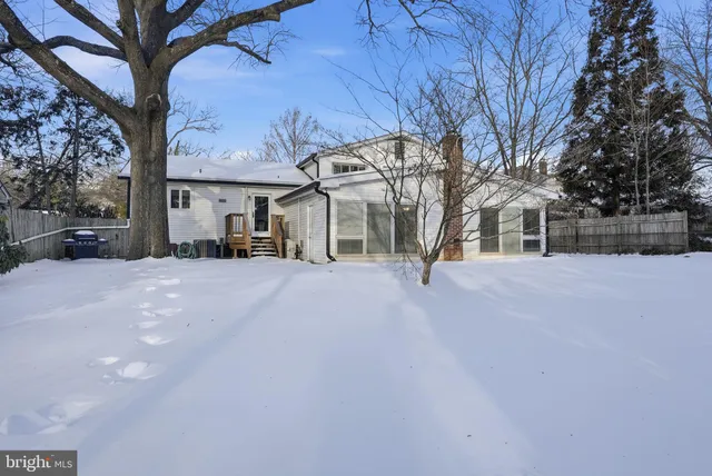 a view of a house with a snow in a yard