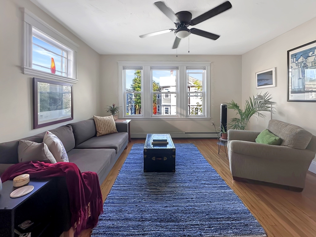 43 Boynton Street, Unit 3R Boston, MA 02130 - Photo 1 of 12 a living room with furniture and a large window