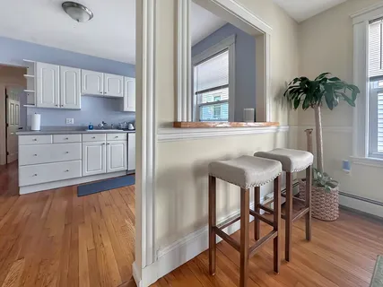 a kitchen with a table and chairs in it