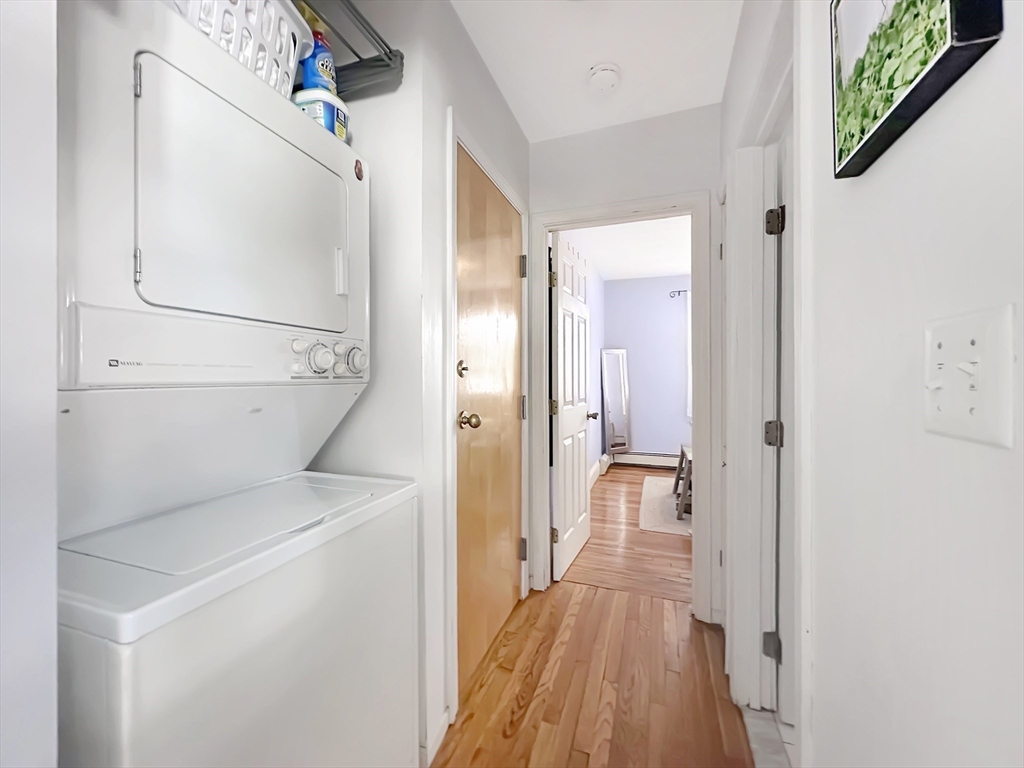 43 Boynton Street, Unit 3R Boston, MA 02130 - Photo 7 of 12 a view of a hallway with wooden floor and bathroom