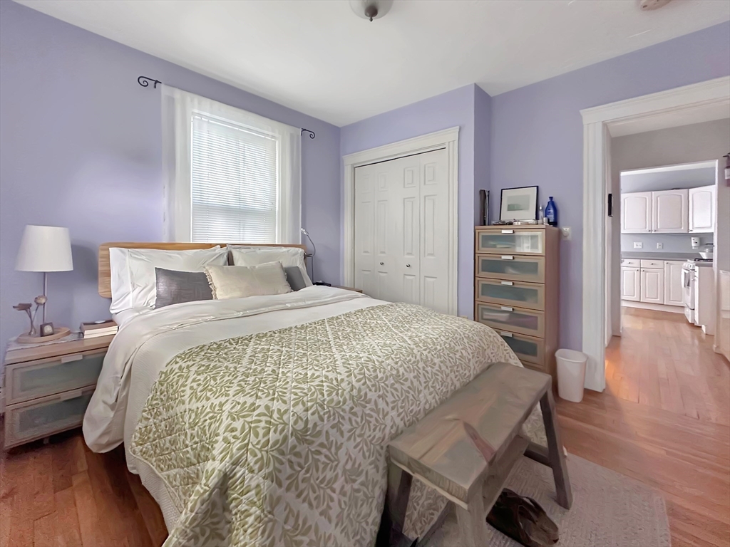 43 Boynton Street, Unit 3R Boston, MA 02130 - Photo 8 of 12 a bedroom with a bed and a wooden floor