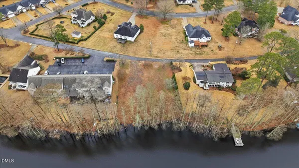 an aerial view of residential building with lake view