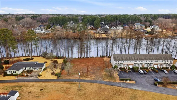 an aerial view of a house with a lake view