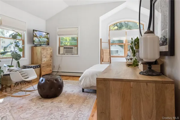 a bedroom with bed and window