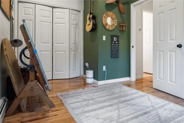 a view of an entryway with wooden floor