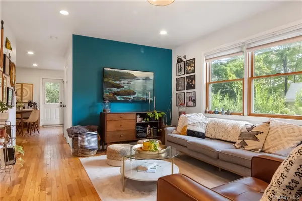 a living room with furniture and a large window