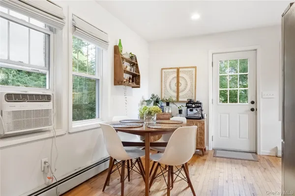 a dining room with furniture and window