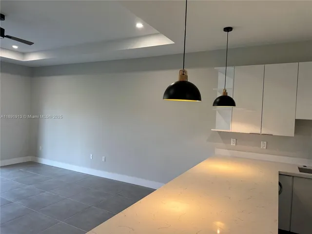 a view of a kitchen with a sink