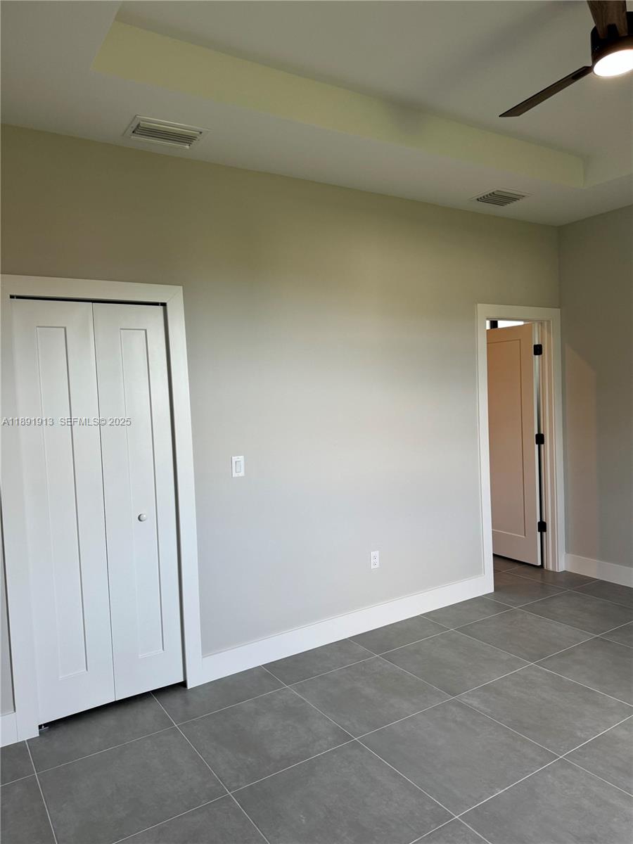 4876-30 30th Street Southwest, Unit 4876 Lehigh Acres, FL 33973 - Photo 4 of 7 a view of an empty room