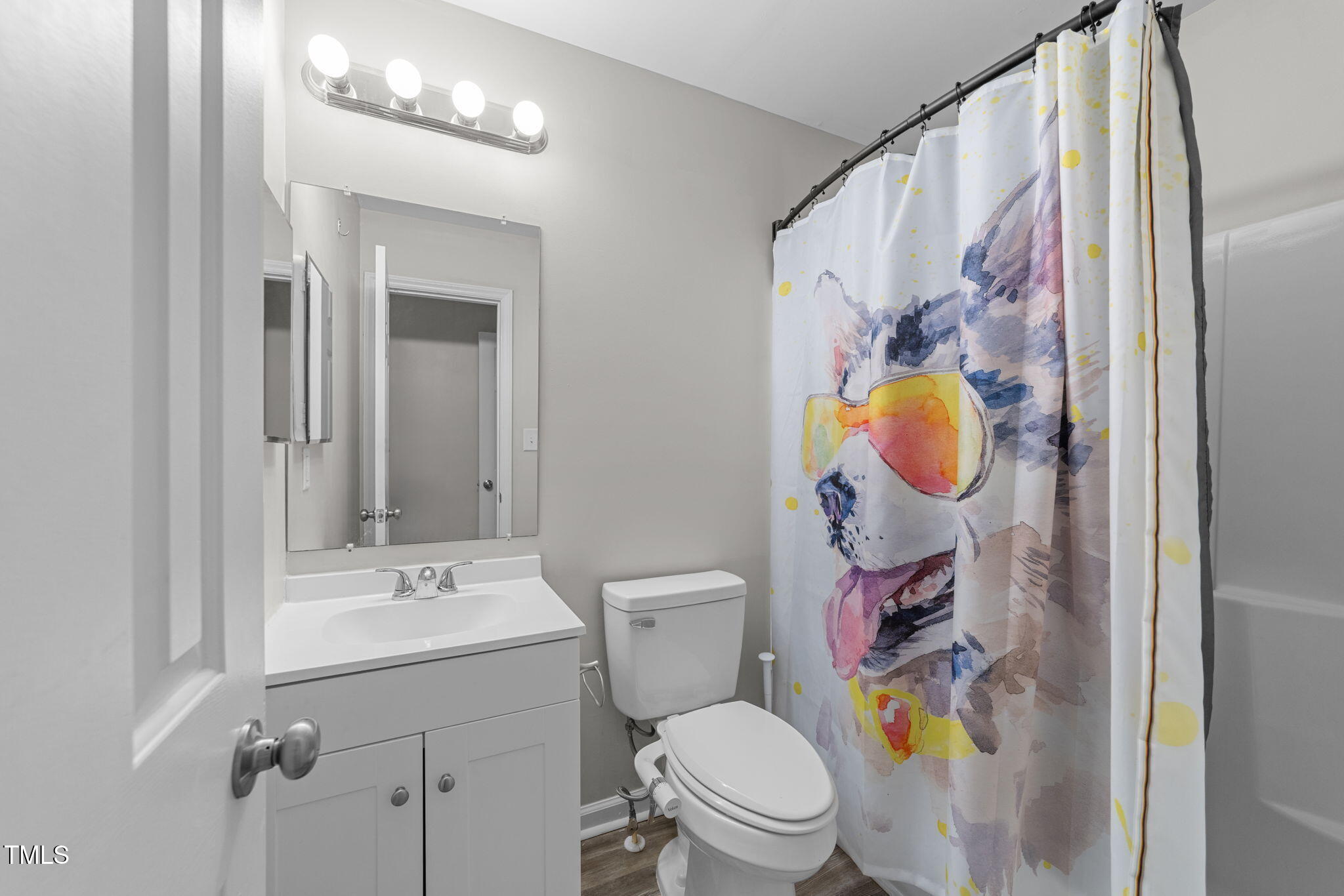 4601 Timbermill Court, Unit 303 Raleigh, NC 27612 - Photo 17 of 37 a bathroom with a sink toilet and mirror