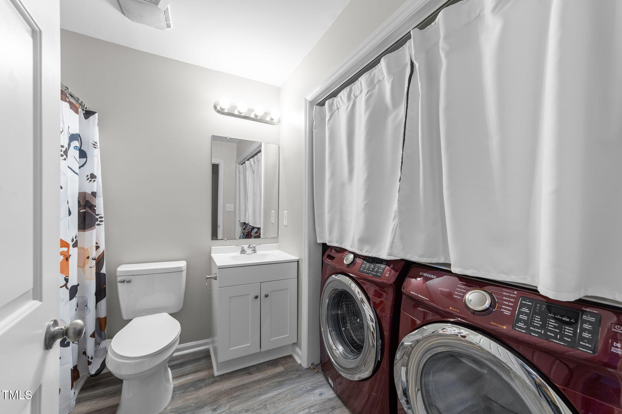 4601 Timbermill Court, Unit 303 Raleigh, NC 27612 - Photo 22 of 37 a bathroom with a toilet sink and mirror