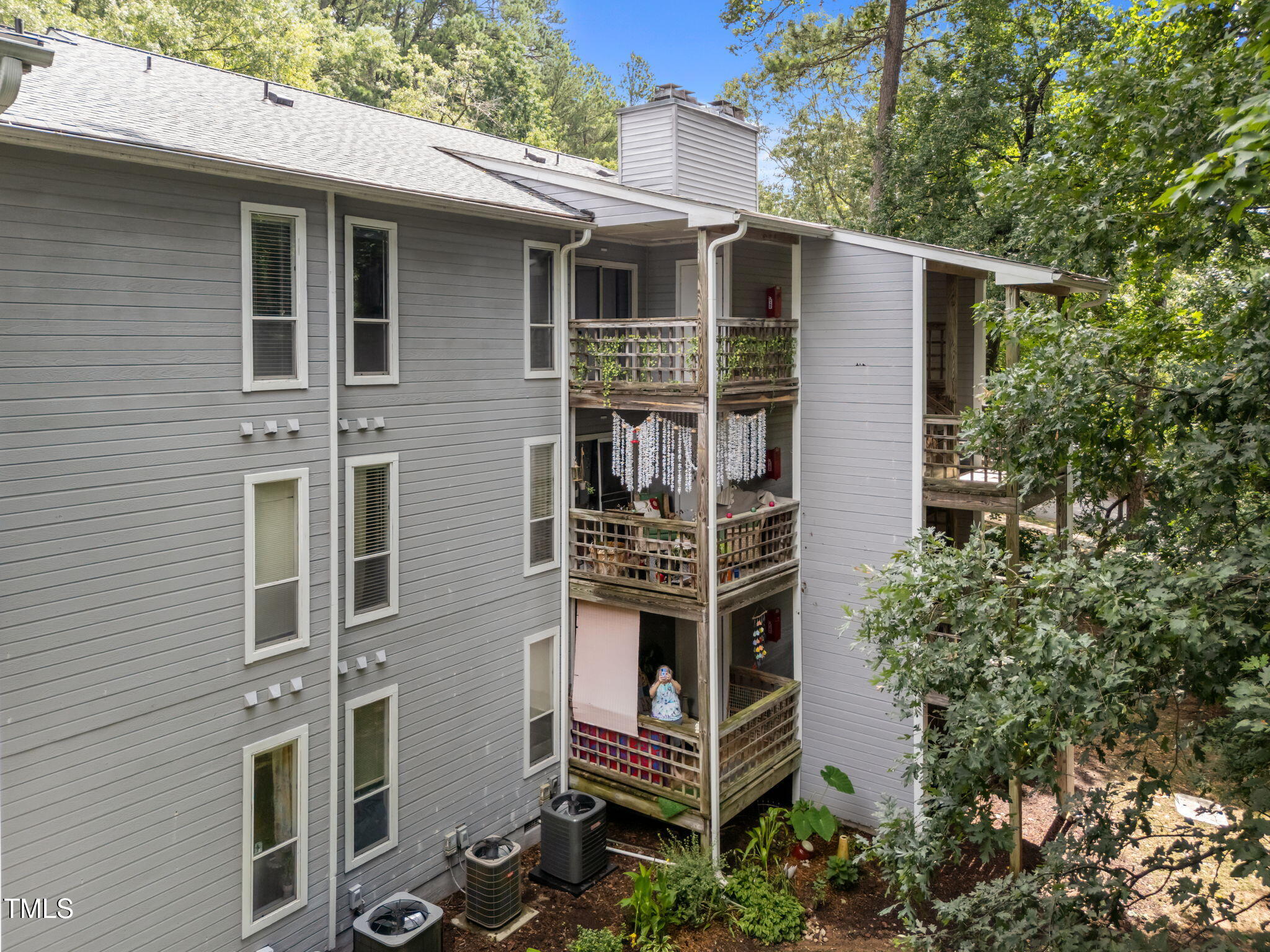 4601 Timbermill Court, Unit 303 Raleigh, NC 27612 - Photo 27 of 37 a front view of a house with a yard