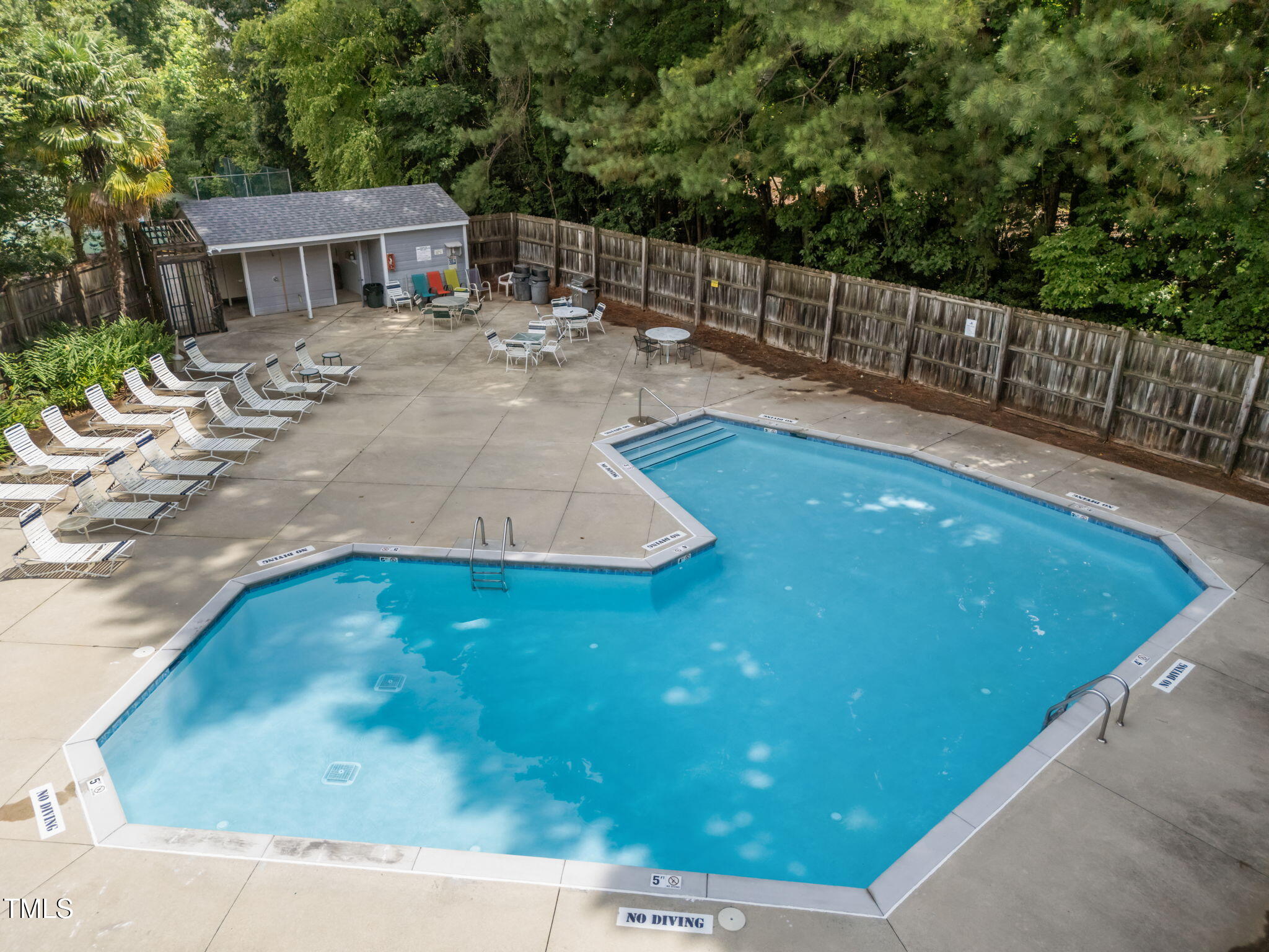 4601 Timbermill Court, Unit 303 Raleigh, NC 27612 - Photo 28 of 37 a view of a backyard with sitting area