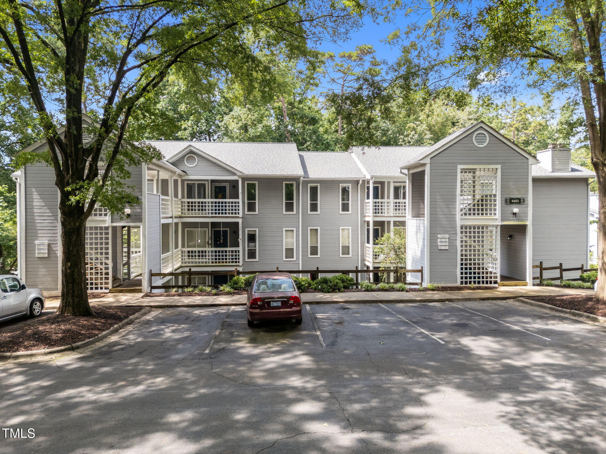 4601 Timbermill Court, Unit 303 Raleigh, NC 27612 - Photo 2 of 37 a car parked in front of a house