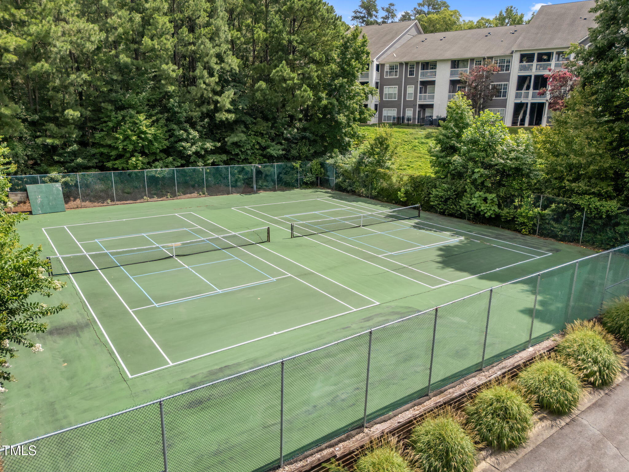 4601 Timbermill Court, Unit 303 Raleigh, NC 27612 - Photo 29 of 37 a view of a tennis court