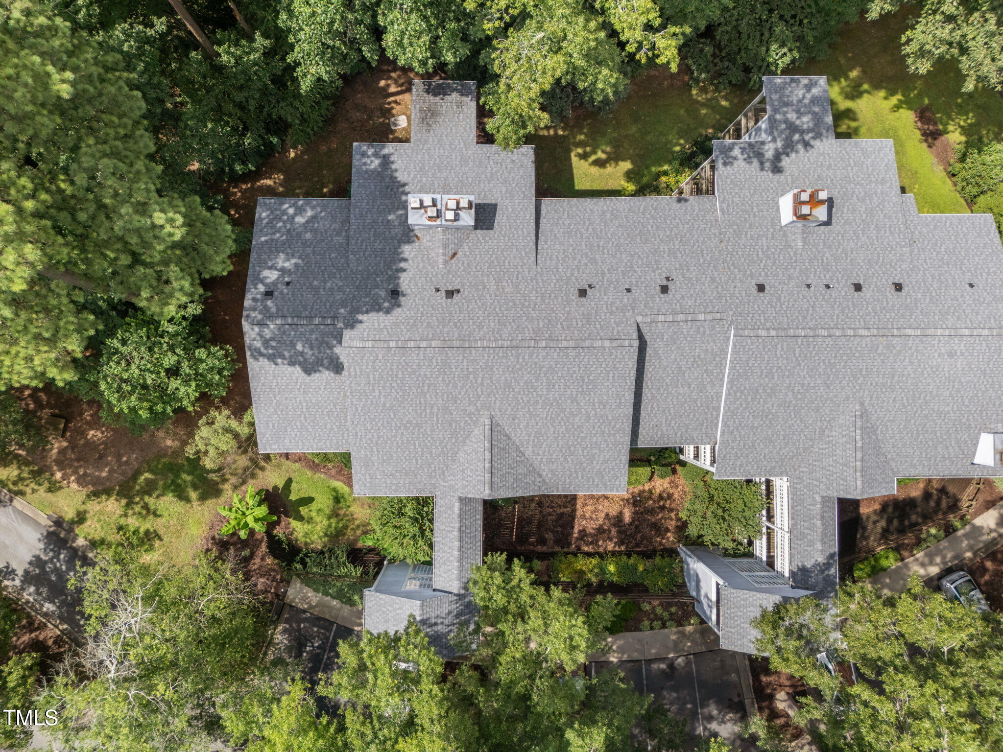 4601 Timbermill Court, Unit 303 Raleigh, NC 27612 - Photo 30 of 37 an aerial view of a house with a yard