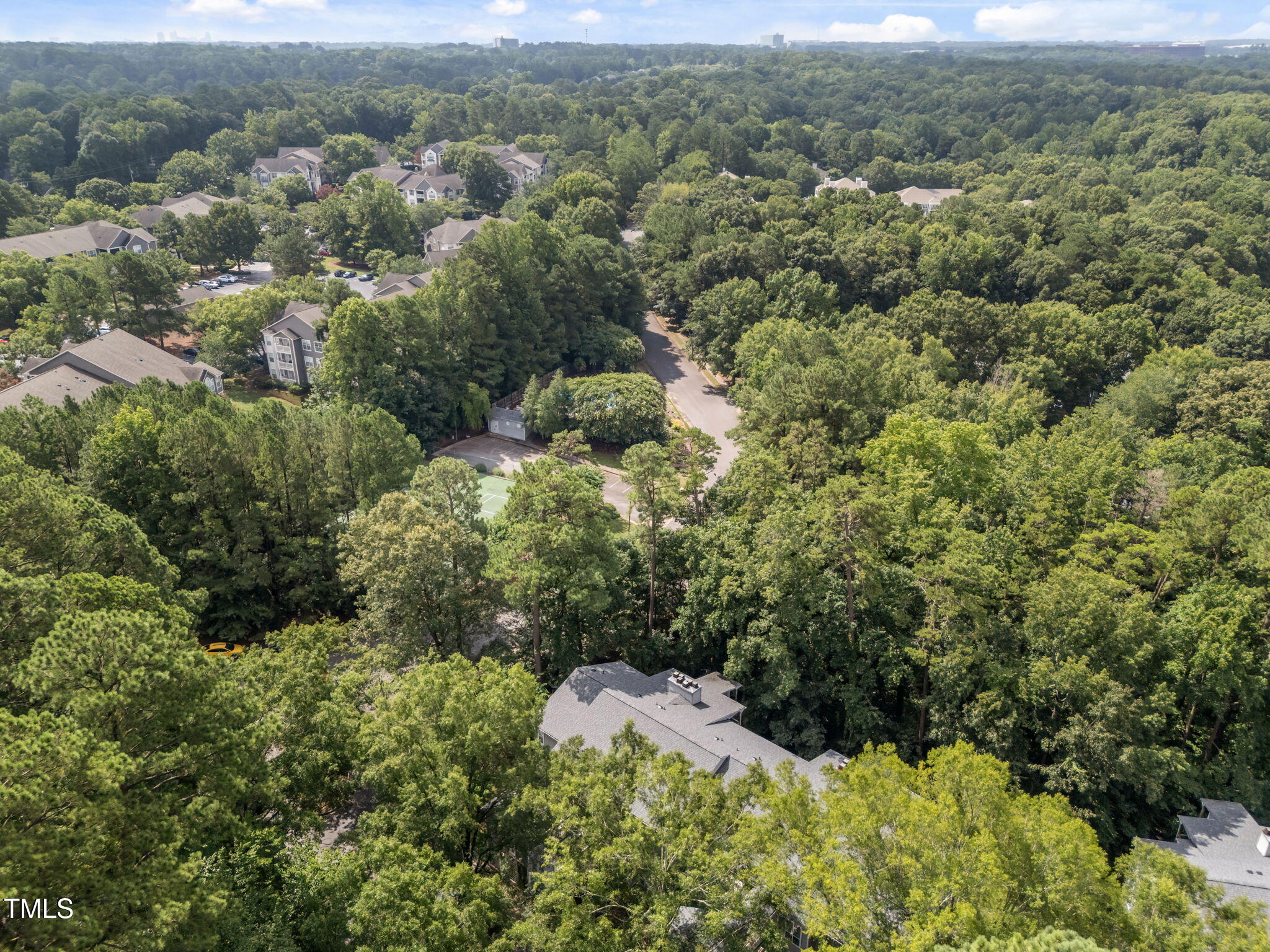 4601 Timbermill Court, Unit 303 Raleigh, NC 27612 - Photo 32 of 37 an aerial view of residential house with outdoor space
