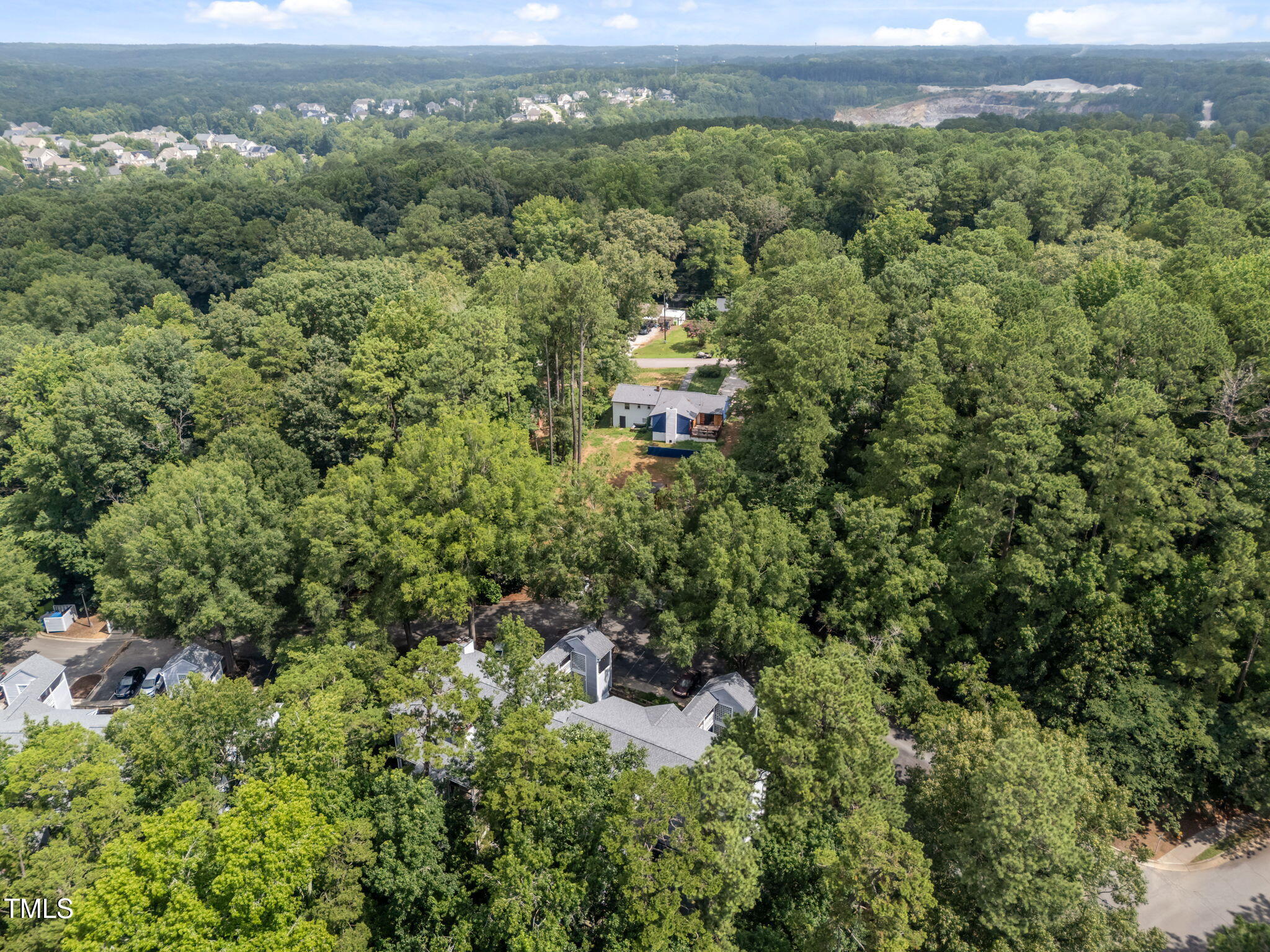 4601 Timbermill Court, Unit 303 Raleigh, NC 27612 - Photo 34 of 37 an aerial view of a house with a yard