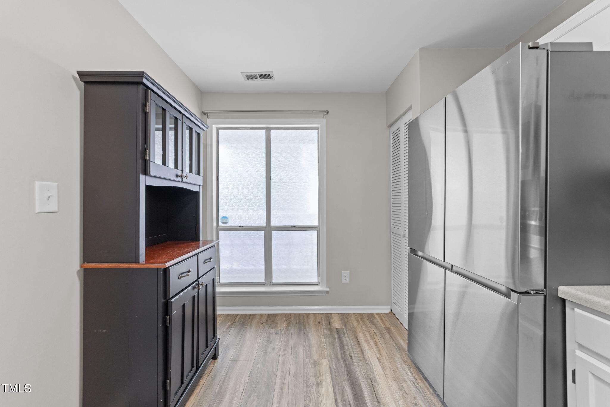 4601 Timbermill Court, Unit 303 Raleigh, NC 27612 - Photo 8 of 37 a view of a livingroom with furniture walk in closet area